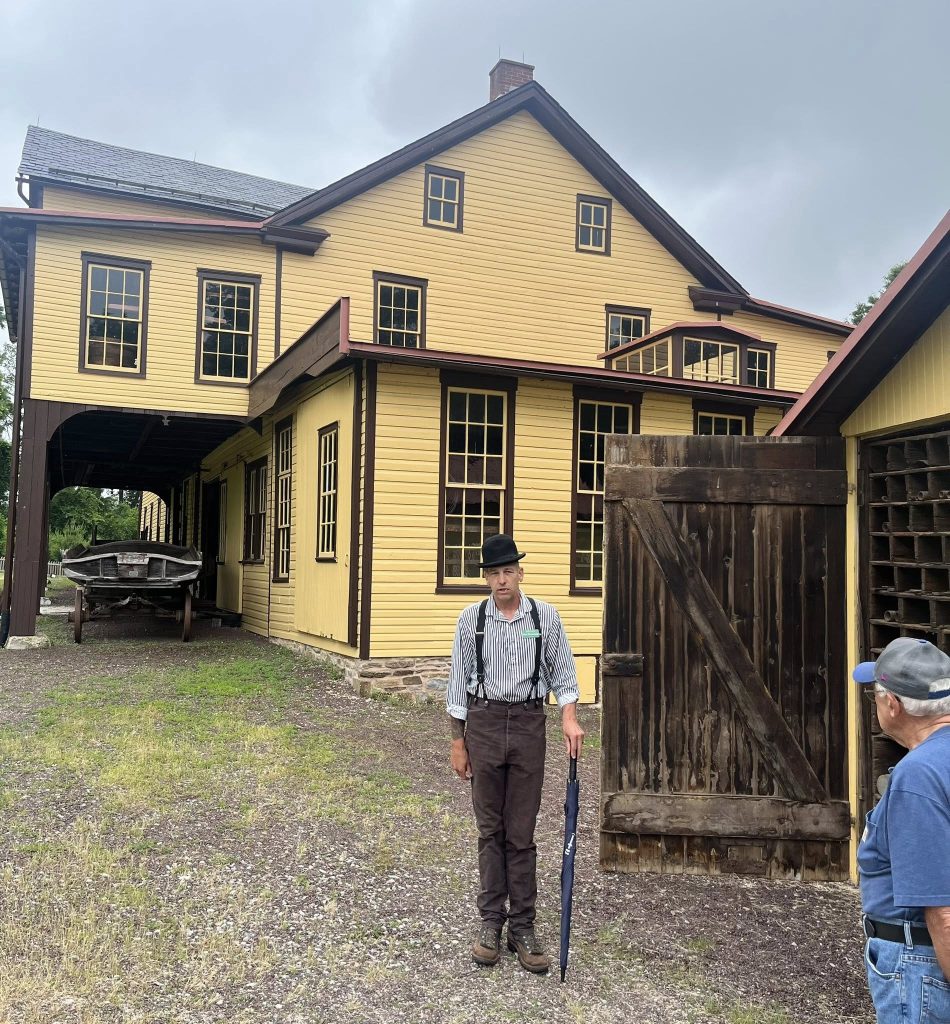 Our knowledgeable tour guide Rob talks about the iron shed outside the wagon works.