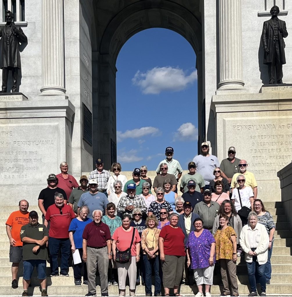hahs gathered at a gettysburg memorial on their field trip