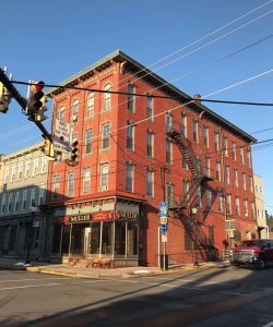 current day photo of the big red building at 4th and state street currently apartments above muller jewelry