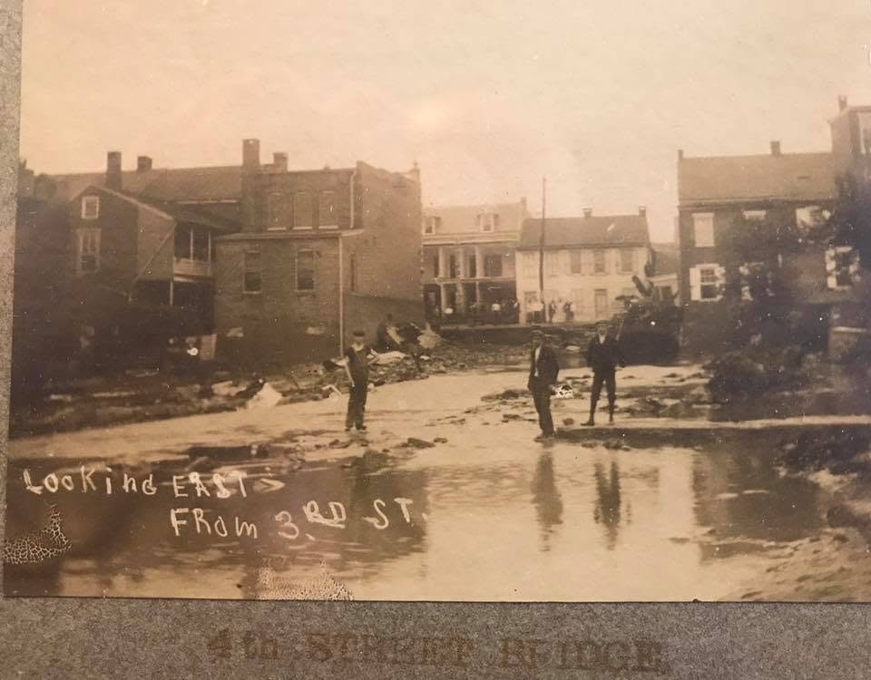 flood waters and damage from creek going under the 4th st bridge, photo from hamburg library