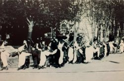 Masqueraders dancing along the streets on the day of King Frost