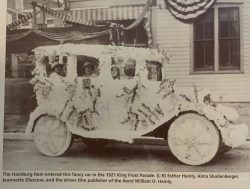 The Hamburg Item in a brightly decorated car, featuring Esther Heinly, Alma Shollenberger, Jeannette Glascow, and driver William O Heinly