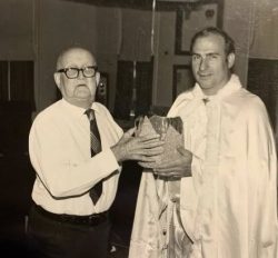 Paul Heffner passing the King Frost crown on to Domer Leibensperger