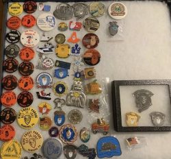 A large collection of the annual King Frost pins