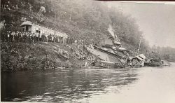 A view of the scene- lots of curious onlookers and those helping to clear the wreckage